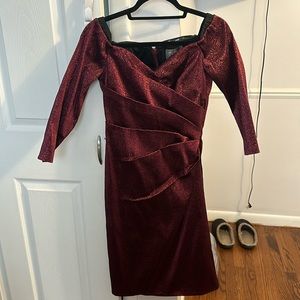 Brand New with Tags Cocktail dress sized 10 but taken in to a size 8. Stretchy!